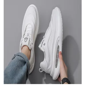 Close-up of white breathable leather dad shoes with a thick sole and air cushion window