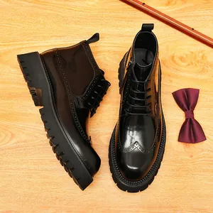 Black glossy leather wingtip brogue boots for men with thick lug soles and side zipper.