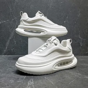 White leather chunky sneakers for men with thick air cushion soles and breathable mesh.