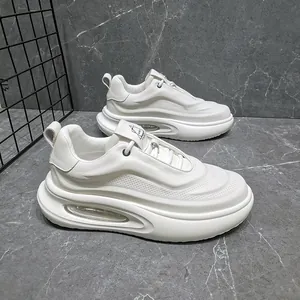 Detail view of white chunky leather sneakers for men with thick platform sole