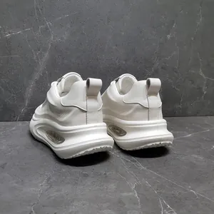 Rear view of white leather men's chunky sneakers with thick height-increasing soles