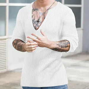 Detail of white ribbed knit shirt for men with deep V-neck and slim fit design