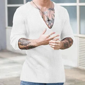 Detail view of white long-sleeved ribbed knit shirt with deep V-neck on male model