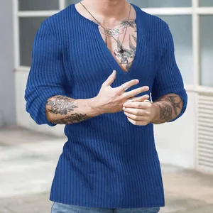 Detail showing the blue ribbed knit texture of a men's deep V-neck slim fit sweater