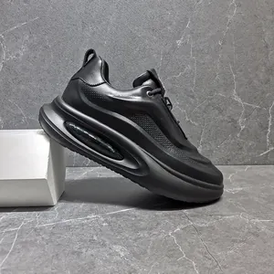Close-up detail of premium black leather chunky sneakers with air cushion and breathable holes