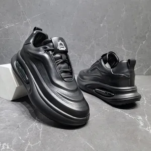 Close-up of black genuine leather men's chunky sneakers with breathable holes