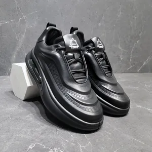 Detailed view of premium black genuine leather chunky sneakers for men with air cushion sole
