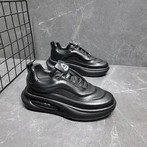 Close-up detail of black genuine leather chunky sneakers with breathable perforated finish