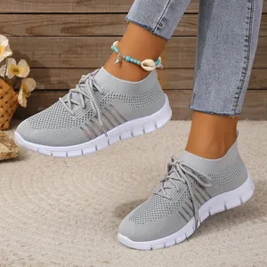 Breathable grey flyknit mesh sneakers for women featuring lace-up casual design