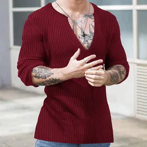 Close-up of men's burgundy slim fit deep V-neck ribbed knit long sleeve sweater