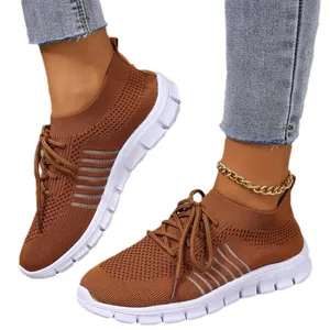 Breathable brown fly-knit mesh sneakers with lace-up design for sports and casual wear.