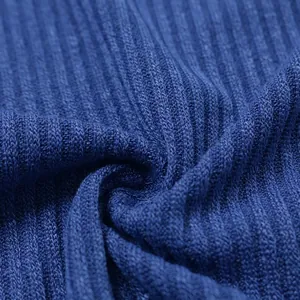 Detailed macro view of the blue ribbed knit fabric texture for men's long sleeve sweater