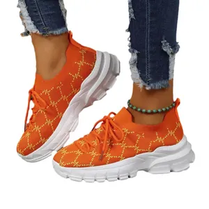 Women's vibrant orange breathable knit chunky sneakers with thick white platform sole