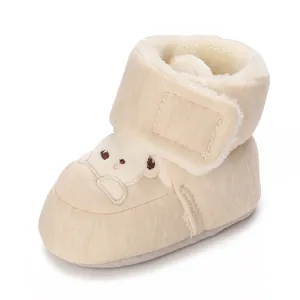 Detailed view of baby winter boot featuring soft fleece lining and cute bear embroidery on toe