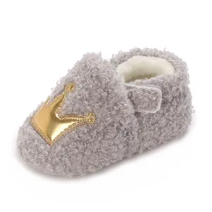 Soft grey sherpa baby bootie with golden crown detail and warm fleece lining