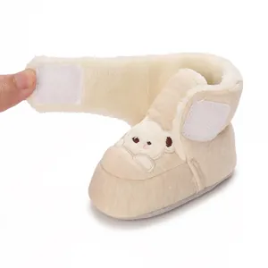 Detail of warm fleece baby walking shoes with bear embroidery and velcro strap