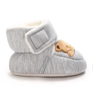 Detailed side view of grey fleece-lined baby winter boots with cartoon bear embroidery