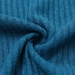 Macro view of soft teal blue ribbed knit fabric for men's lightweight long-sleeve sweater