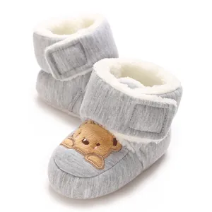 Detailed view of cozy grey baby winter walker boots with warm fleece lining and cute bear motif