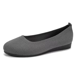 Professional side view of gray breathable knitted flat shoes with round toe design