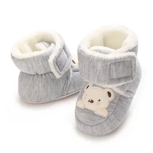 Detailed view of grey fleece-lined winter baby walking shoes with bear embroidery