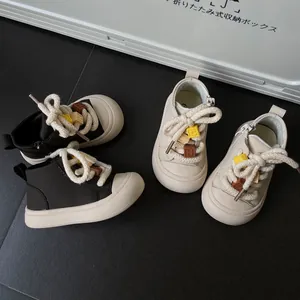 Detail view of toddler casual high-top sneakers with thick cotton rope laces in two colors