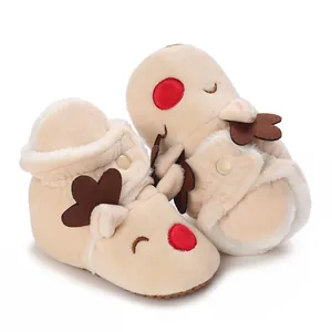 Detail shot of plush beige baby reindeer boots with soft fuzzy lining for winter