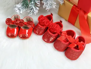 Detailed view of three styles of red glittery Christmas baby princess shoes with bows