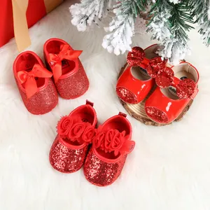 Detailed top view of three styles of red glitter and patent leather baby princess shoes