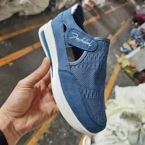 Blue breathable flying woven wedge shoe with velcro strap and Fashion script detail.