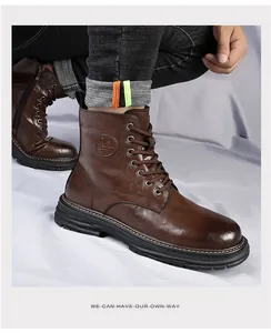 Detail of vintage brown leather high-top Martin boots with thick black soles and laces