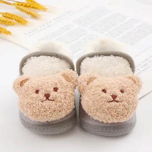Detail view of cute teddy bear plush baby shoes featuring soft warm lining for infants