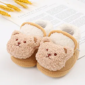 Cozy brown baby walking shoes featuring a cute cartoon bear design and soft fleece lining