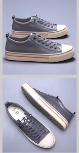 Detalle de zapatillas casuales grises para hombre con parte superior de cuero