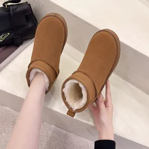 Warm chestnut flat snow boots with cozy white faux fur lining for women in winter