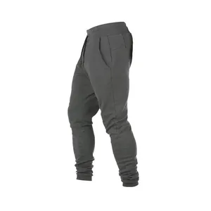 Seitenansicht schmale anthrazitfarbene Herren-Jogginghose mit Rippbündchen und Taschen.