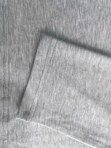 Detailed view of grey knitted fabric texture and double-needle stitching on a cardigan