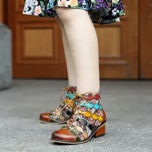 Detailed view of handmade genuine leather vintage patchwork western-style ankle boots