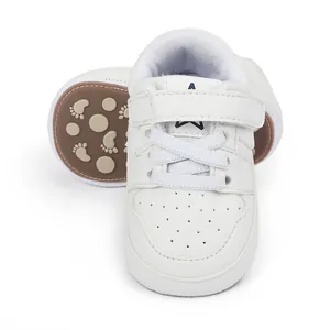 Comfortable white leather baby walking shoes featuring a navy star and non-slip rubber sole