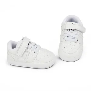 Premium white baby indoor walking shoes with adjustable Velcro strap and soft sole