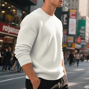 Close-up detail of a men's white waffle knit crewneck sweater in a relaxed American style.