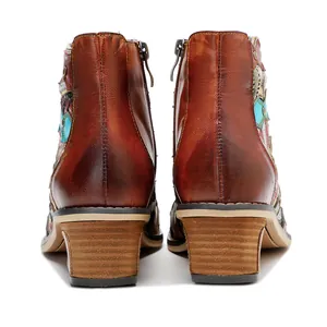 Rear view of vintage patchwork leather boots with colorful ethnic patterns and block heels