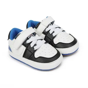 Sporty baby sneakers with blue accents and easy velcro strap