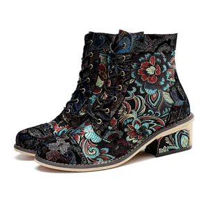 Detailed side view of retro floral print lace-up ankle boots with block heel