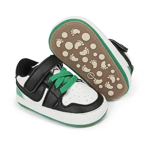 Detailed view of casual baby walking shoes with anti-slip rubber soles in black and green