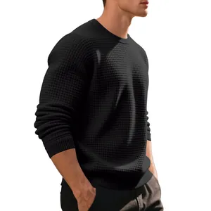 Detail view of men's black waffle textured crewneck sweatshirt with ribbed cuffs.