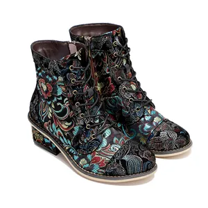 Detailed view of vintage Chinese style floral embroidery on women's ankle boots.