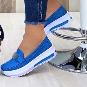 Blue platform loafers for women featuring round toe and decorative metal buckle detail.