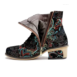 Detailed side view of vintage floral embroidered ankle boot with an open side zipper