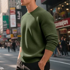 Close-up of olive green waffle knit texture on men's crewneck long sleeve sweatshirt.